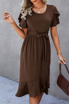 Model showcasing a stylish cocoa colored hot chocolate midi dress with ruffle sleeves and a belted waist.