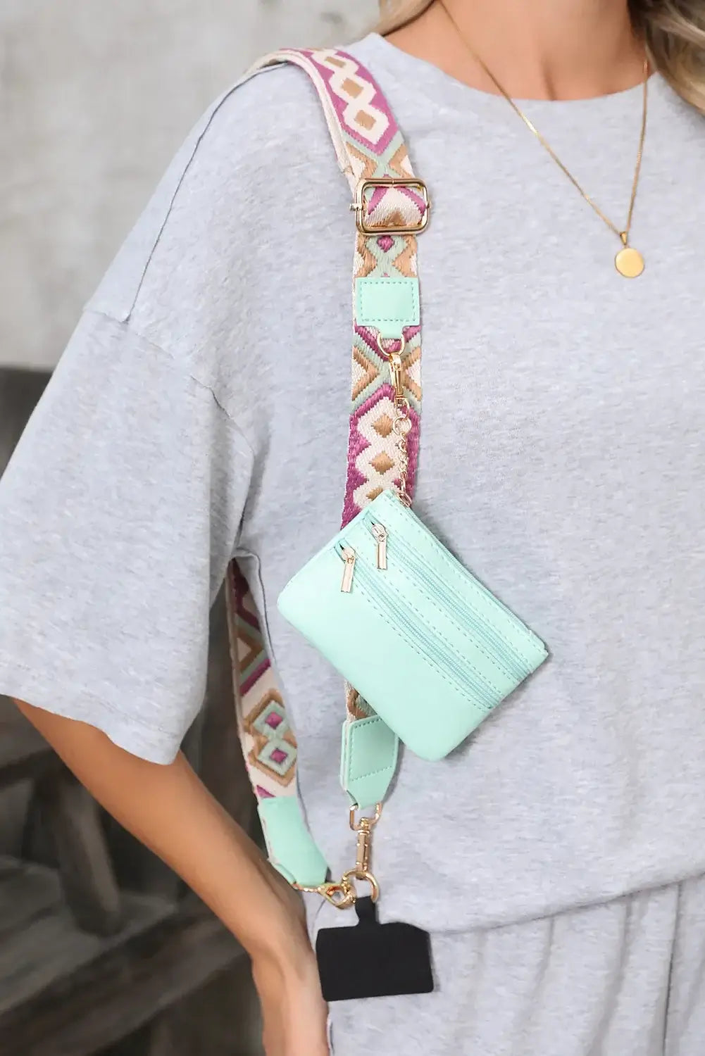 HANDS FREE HARMONY CROSSBODY in mint green with a geometric strap and detachable pouch, styled for casual wear.