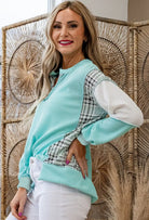 Aqua Avenue Top featuring ribbed texture and plaid patchwork design in a relaxed fit for everyday comfort.