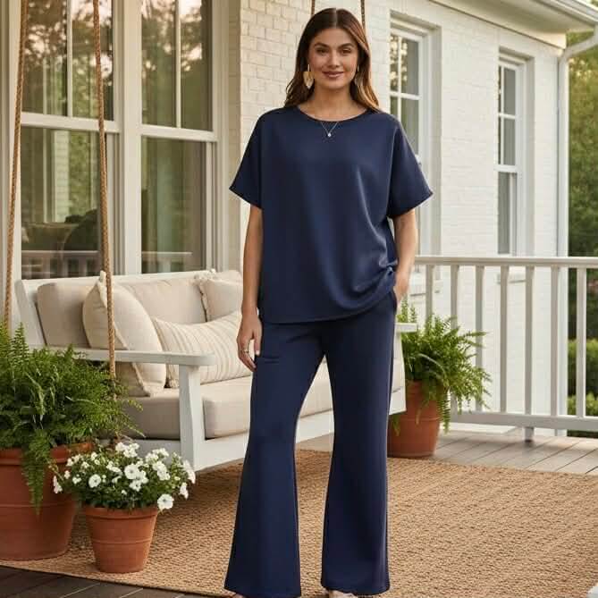 Model wearing HARBORLINE 2 PIECE PANTS SET, a stylish and comfortable navy outfit perfect for any occasion.