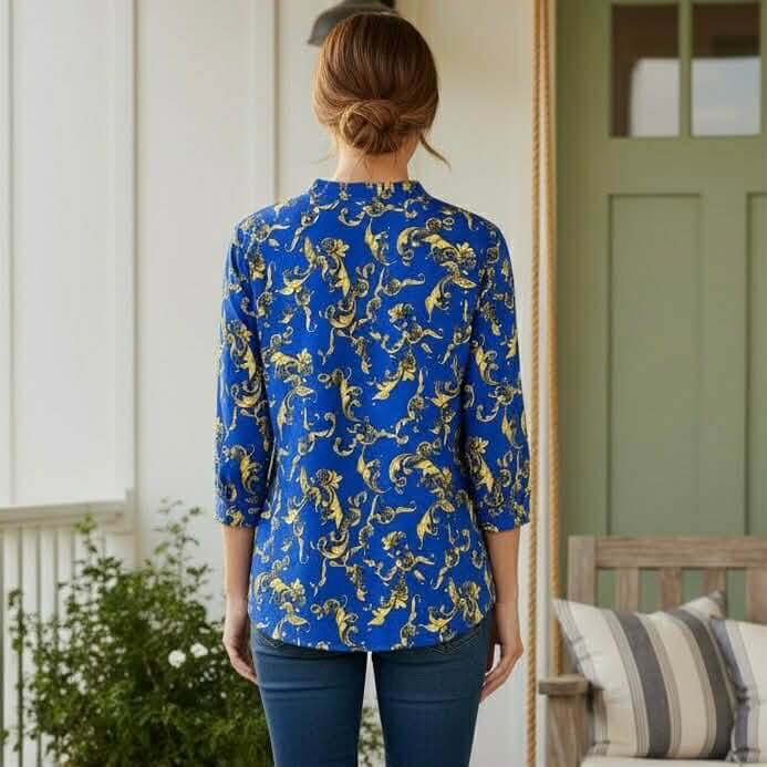 DYNAMIC STYLE TOP - Dear Scarlett (blue) featuring a vibrant floral pattern and split neckline, shown from the back.