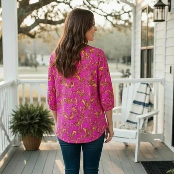DYNAMIC STYLE TOP - Dear Scarlett (pink) worn by a woman outdoors with a stylish design and vibrant colors.
