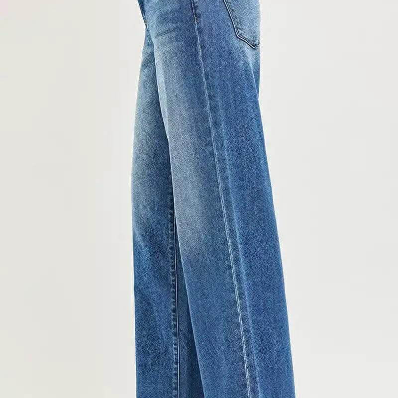 Side view of RISEN KAI WIDE LEG JEANS showcasing relaxed fit and midrise design.