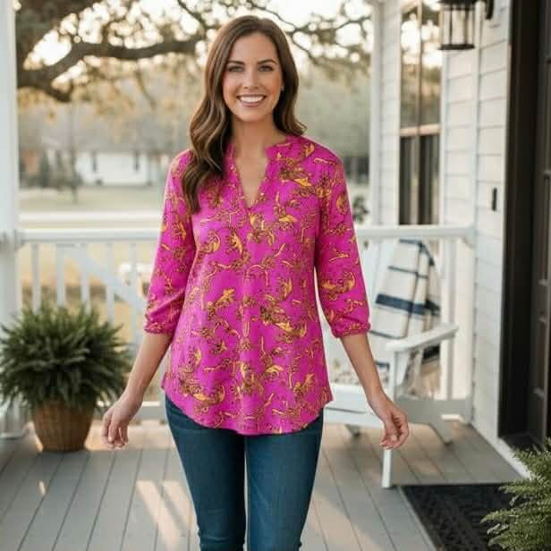 DYNAMIC STYLE TOP - Dear Scarlett (pink) displayed on a model in a vibrant pink print with a flattering split neckline.