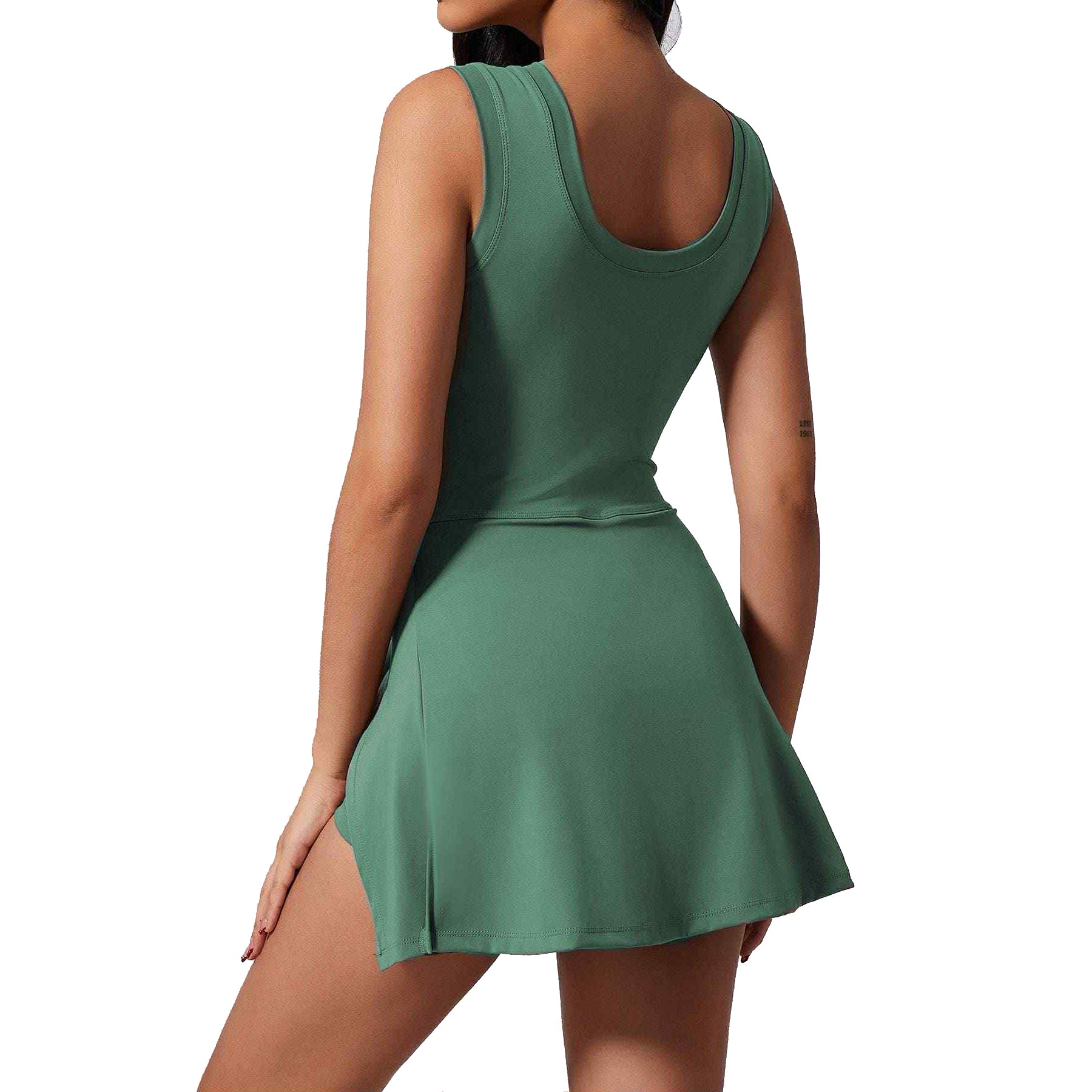 Back view of a jade Power Play Dress by Otos New York, showcasing its sporty and stylish design for active women.