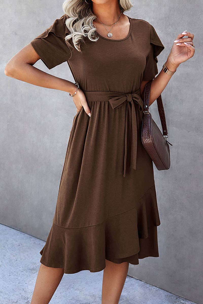 Model wearing HOT CHOCOLATE MIDI DRESS with petal sleeves and ruffle trim, styled with a brown handbag.