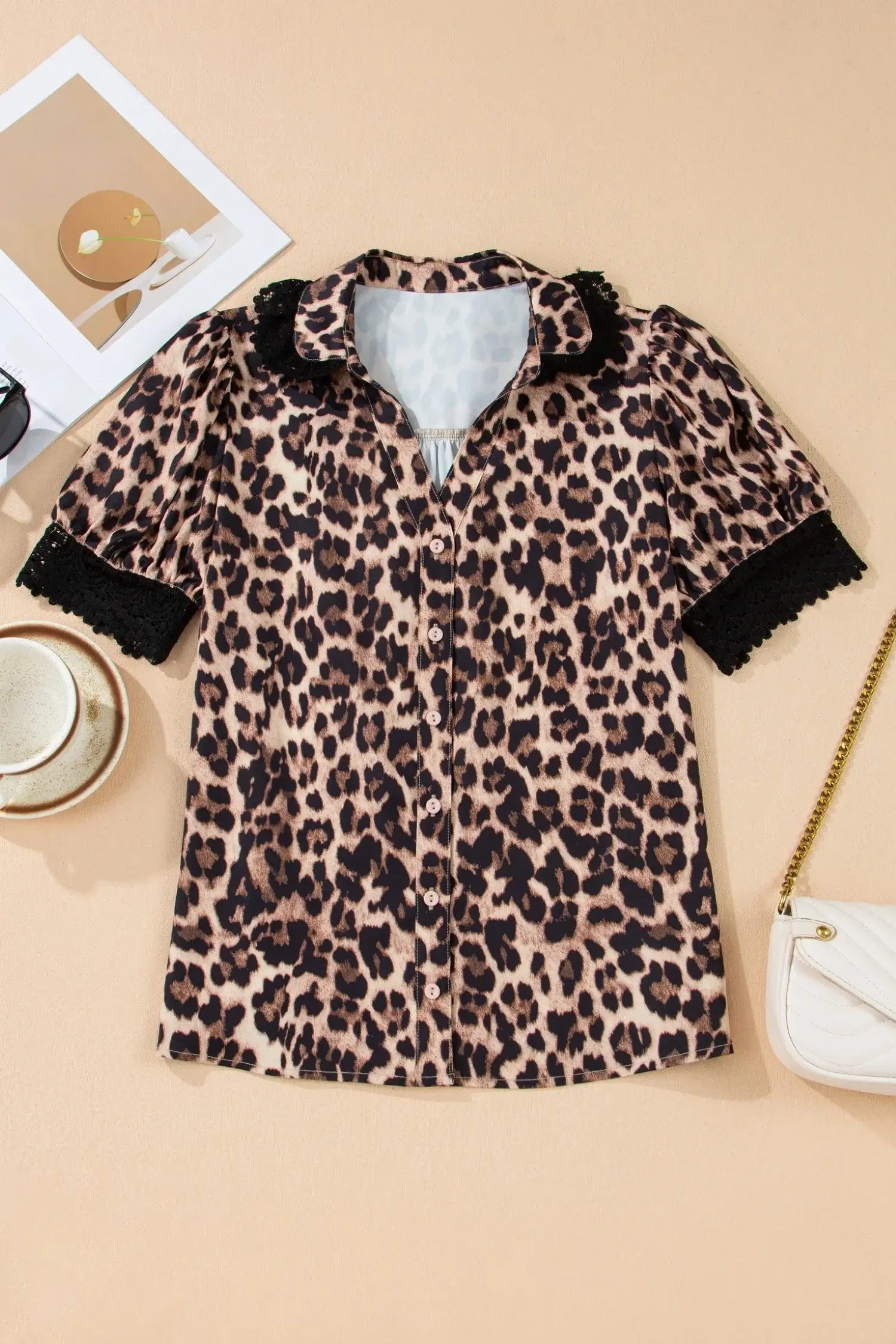 LEOPARD AND LACE TOP featuring a brown leopard print, button-down design with lace trim sleeves.