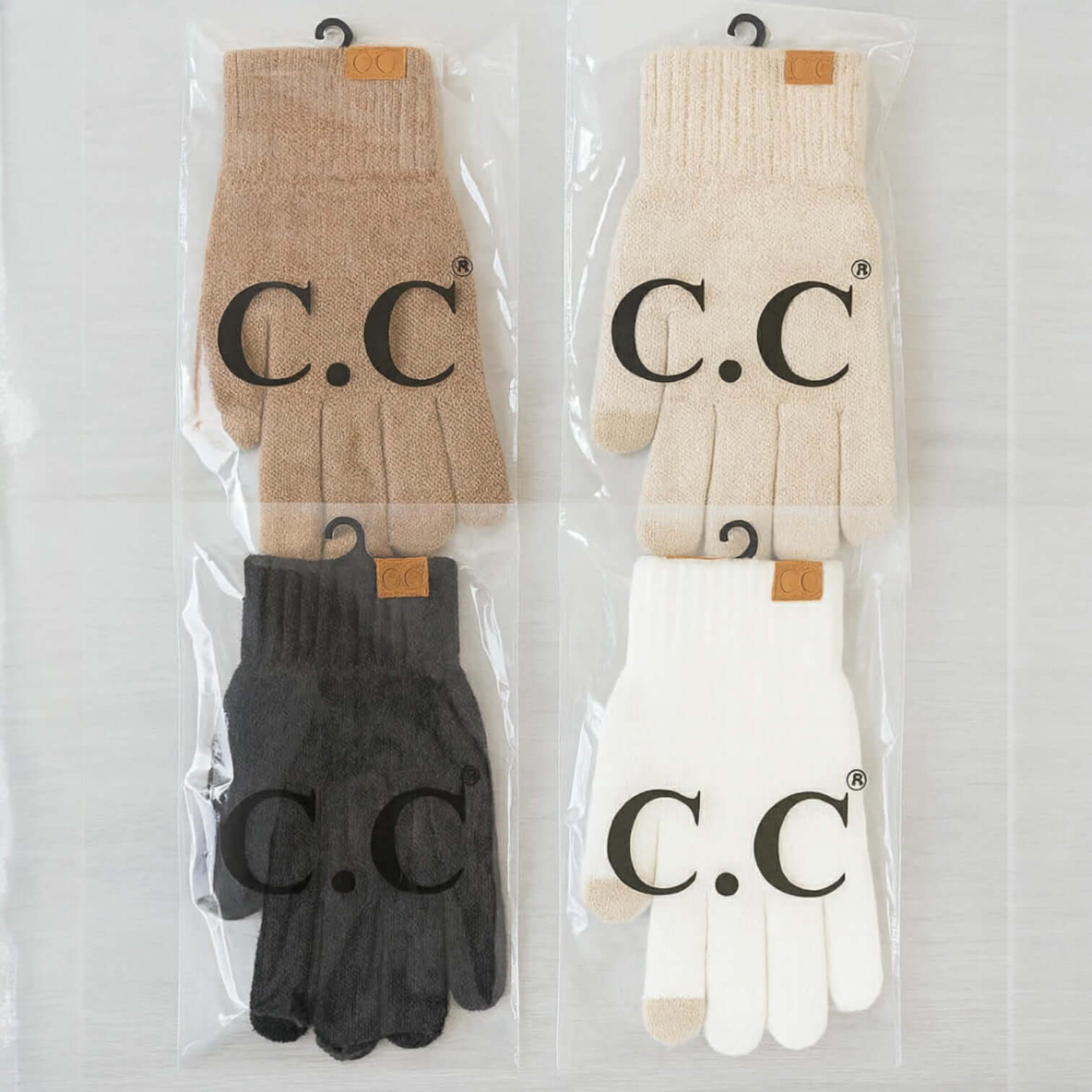C.C. Winter Gloves (6 colors) displayed in packaging, showcasing beige, white, black, and gray options.