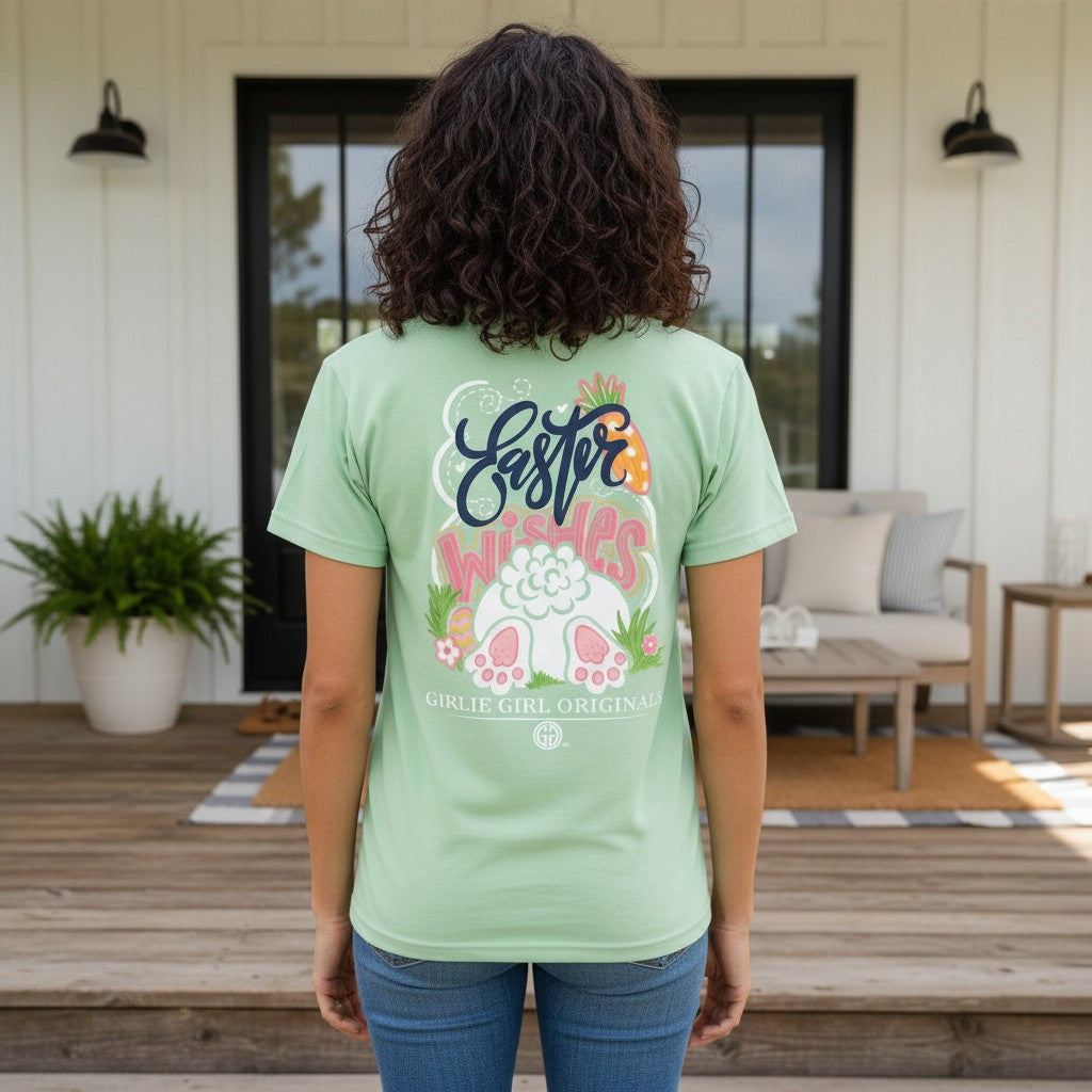 Back view of a person wearing the EASTER WISHES TEE - Girlie Girl Originals in mint, showcasing a fun Easter graphic design.