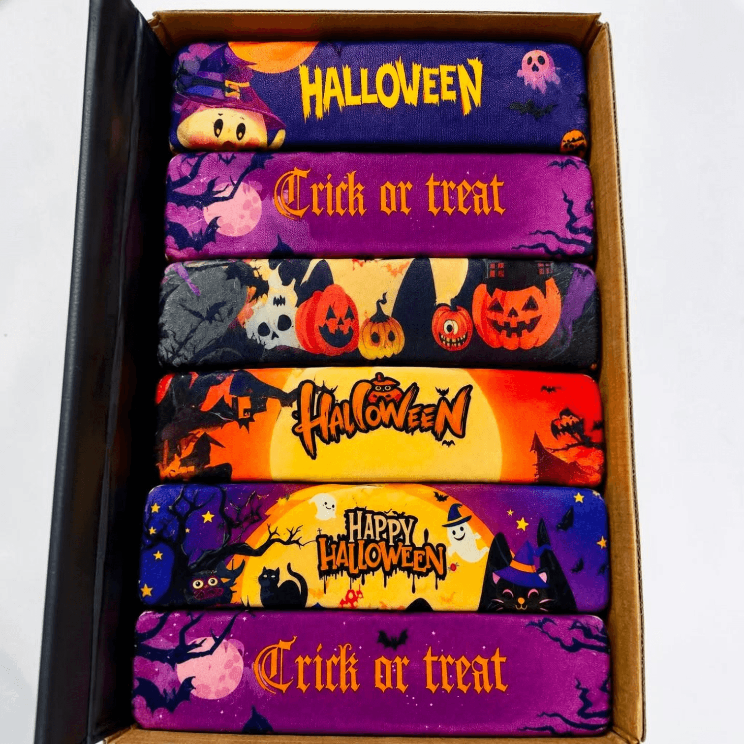 HALLOWEEN BUTTER SQUISHY collection in colorful boxes with spooky designs and themed text for Halloween fun.