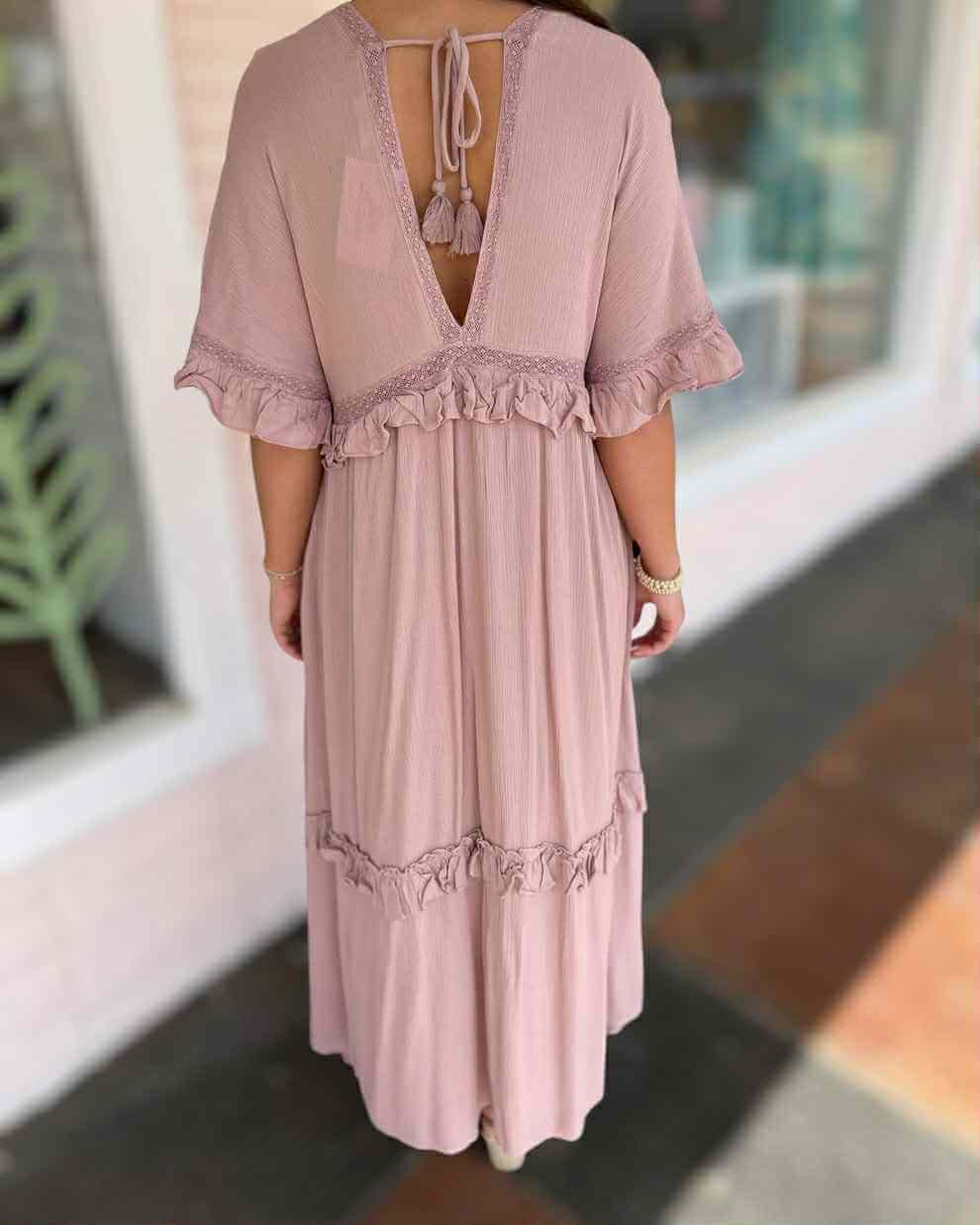 Back view of the pink Ever After Maxi Dress featuring ruffles and tie-back detail, perfect for cottagecore style.