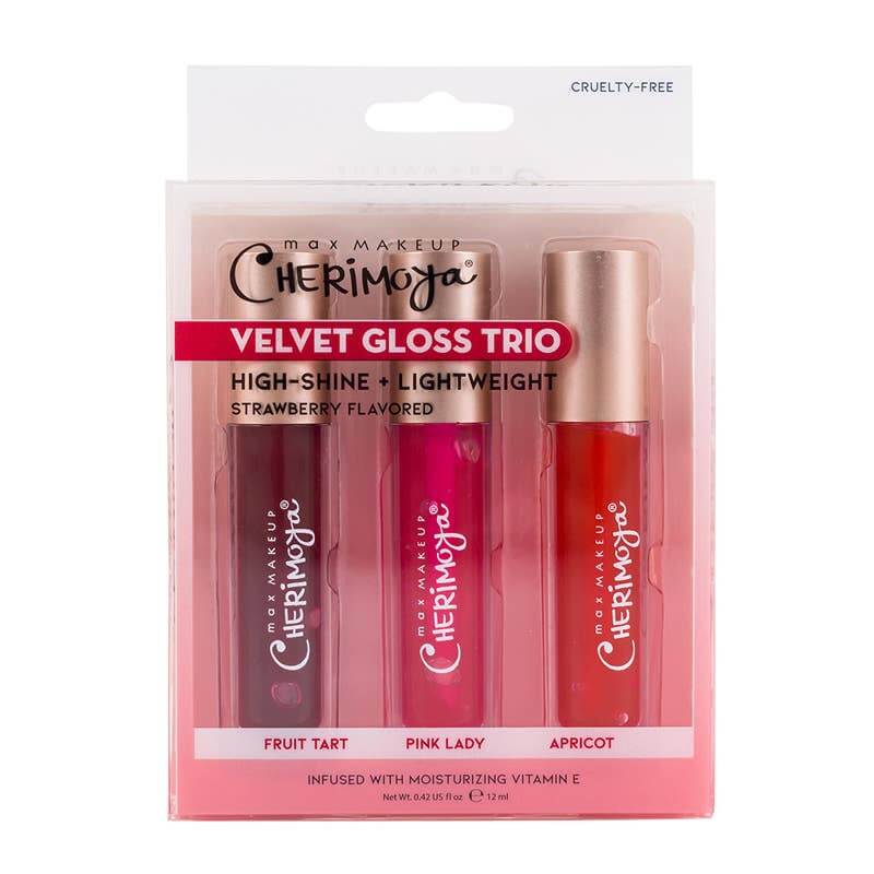 VELVET GLOSS TRIO By Max Makeup packaging with three gloss shades: Fruit Tart, Pink Lady, and Apricot, cruelty-free and strawberry flavored.