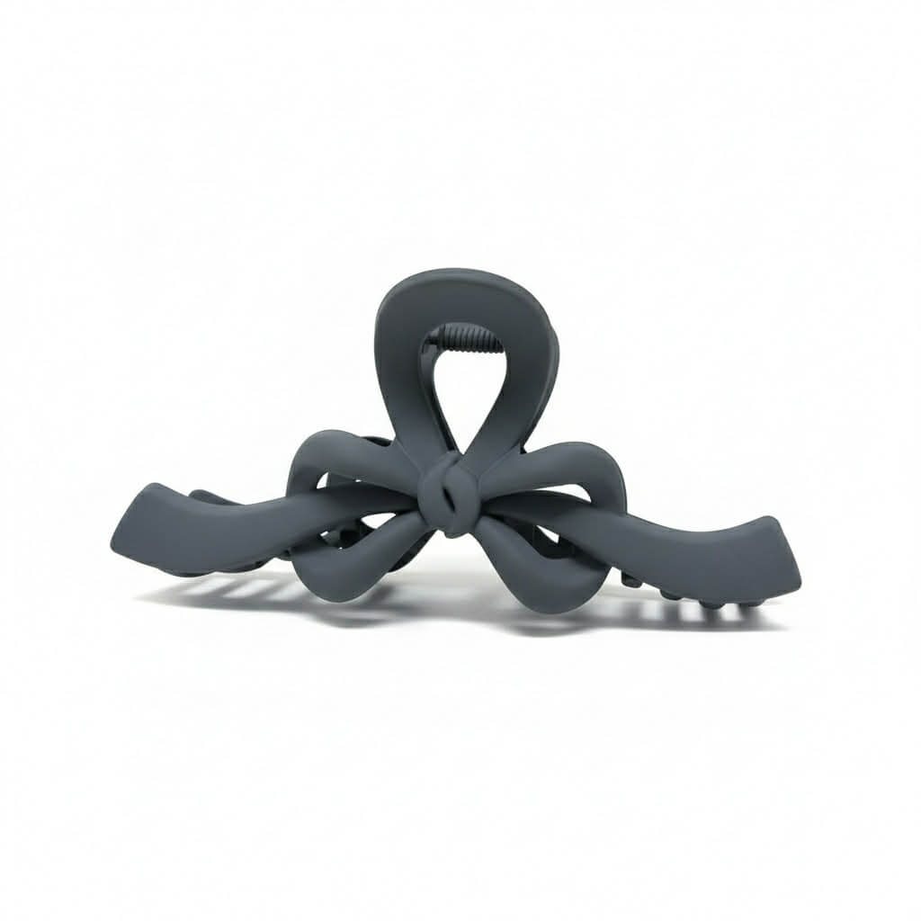 RIBBON REVIVAL HAIR CLIP (7 colors) - Matte bow claw clip in gray with a smooth finish and strong grip for effortless styling.