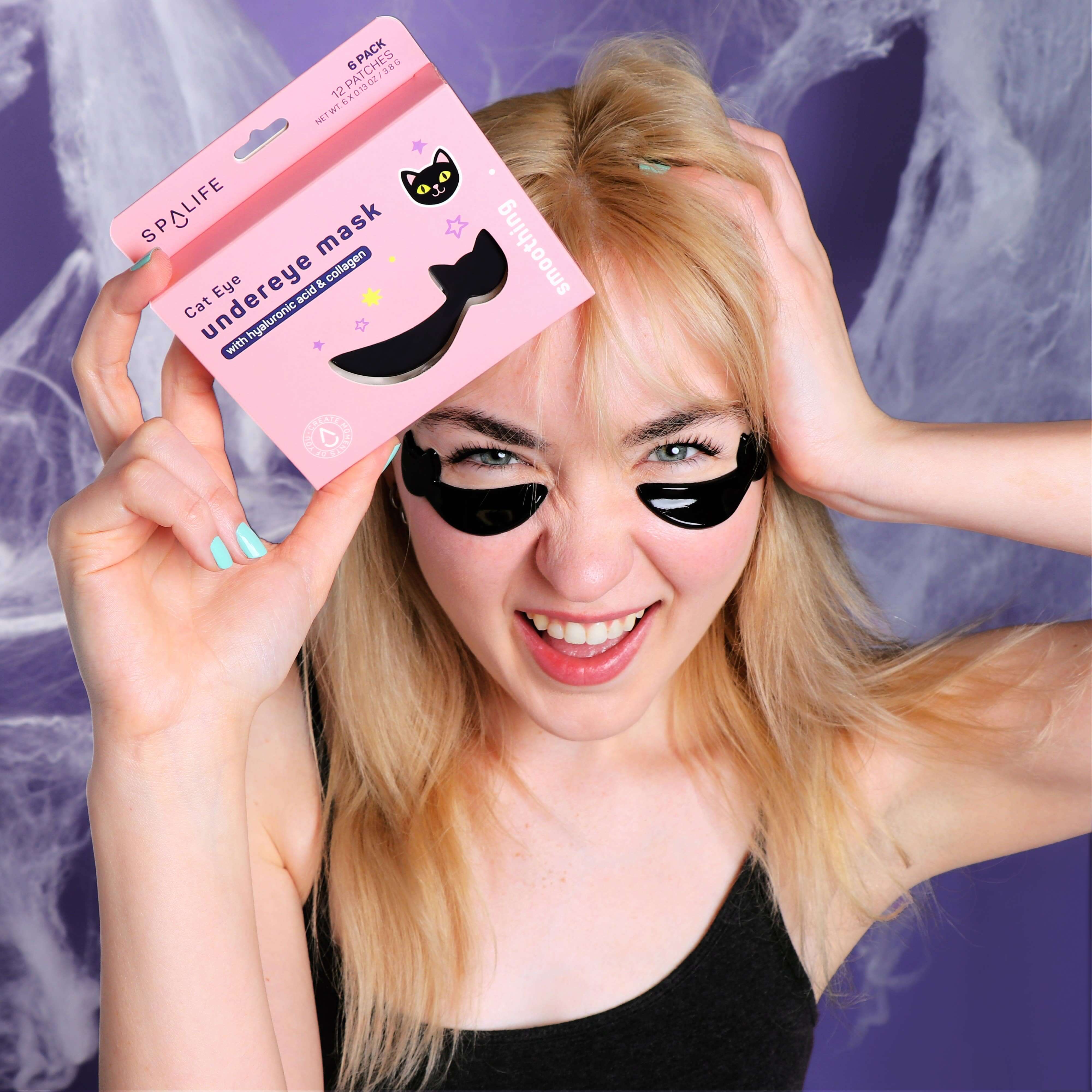 A happy person using CAT EYE UNDEREYE MASKS by SpaLife, showcasing the cat-shaped masks during a fun skincare routine.