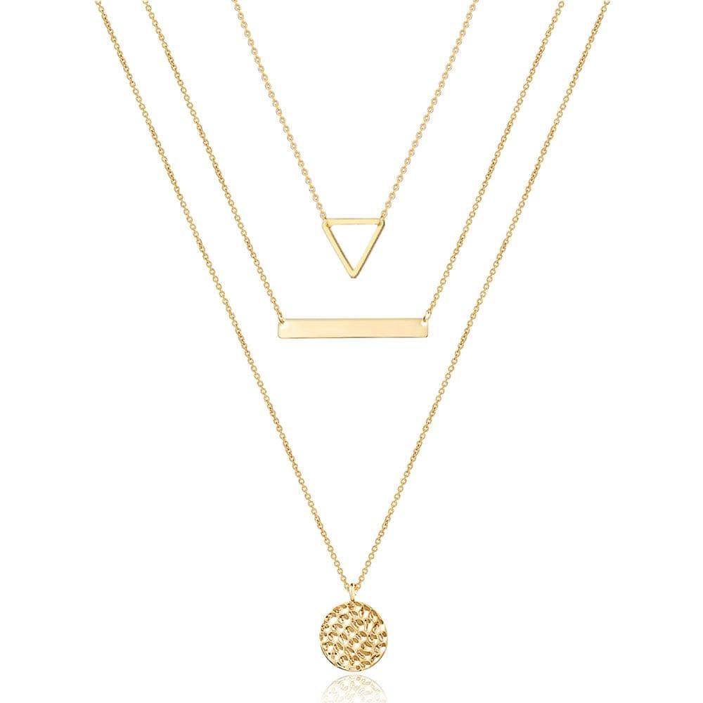 Shapes of Life Necklace Set featuring triangle, bar, and circle pendants in gold, symbolizing balance and personal growth.