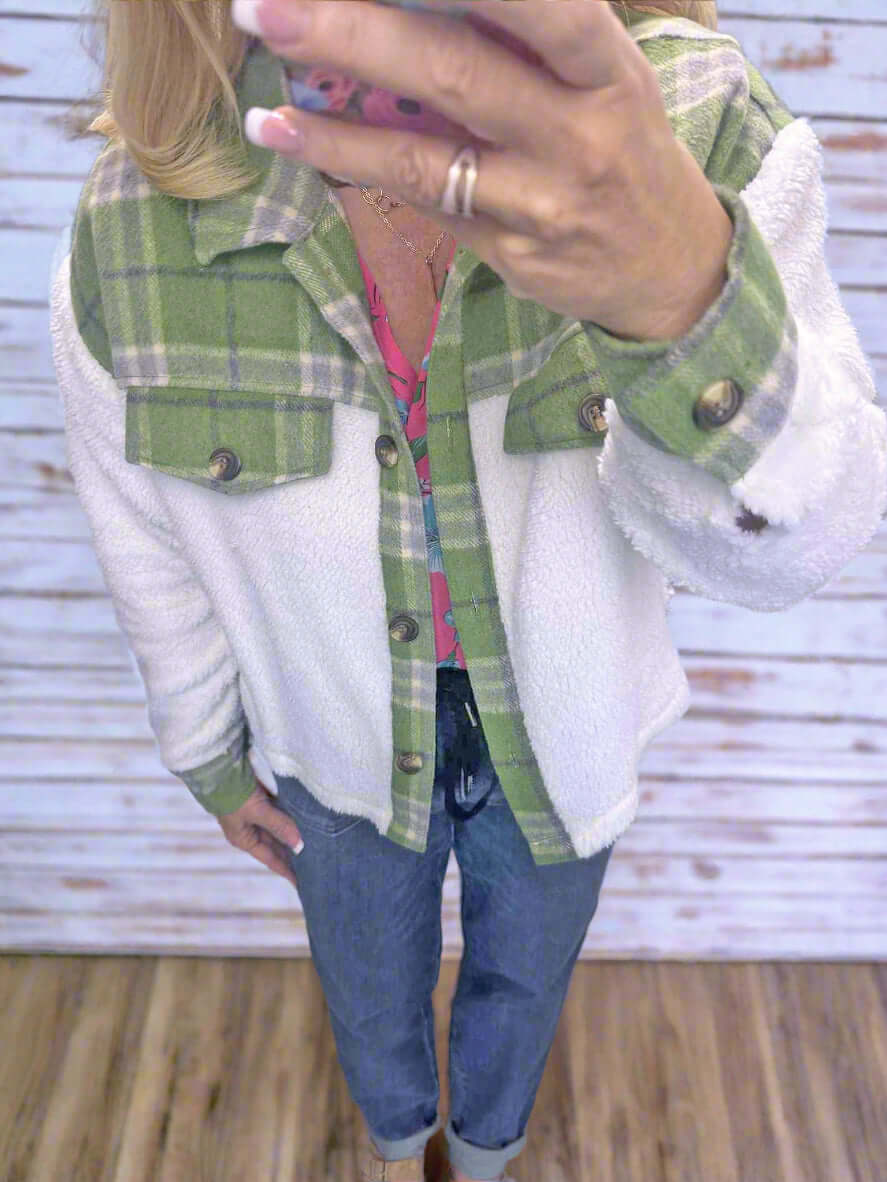 ALPINE CHARM JACKET with green plaid flannel and sherpa design, styled with casual jeans.