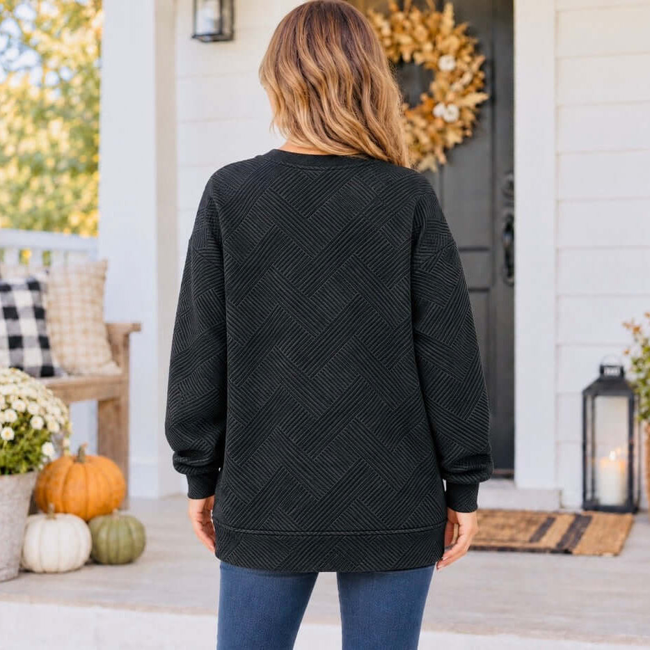 Warm Wishes Pullover (black) features a textured pattern, relaxed fit, and cozy style, perfect for everyday wear.