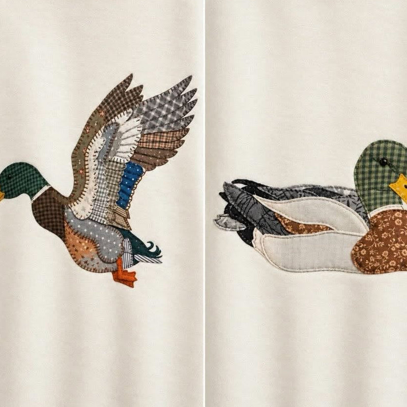 MALLARD MOMENTS (2 STYLES) featuring stitched duck designs: In Flight and Sitting Duck on a crewneck.