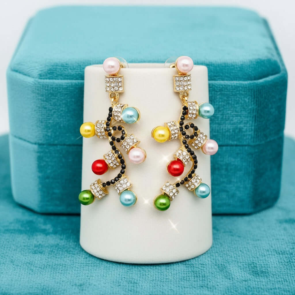 LIGHTS OF JOY EARRINGS featuring colorful bulbs and rhinestones on a display.