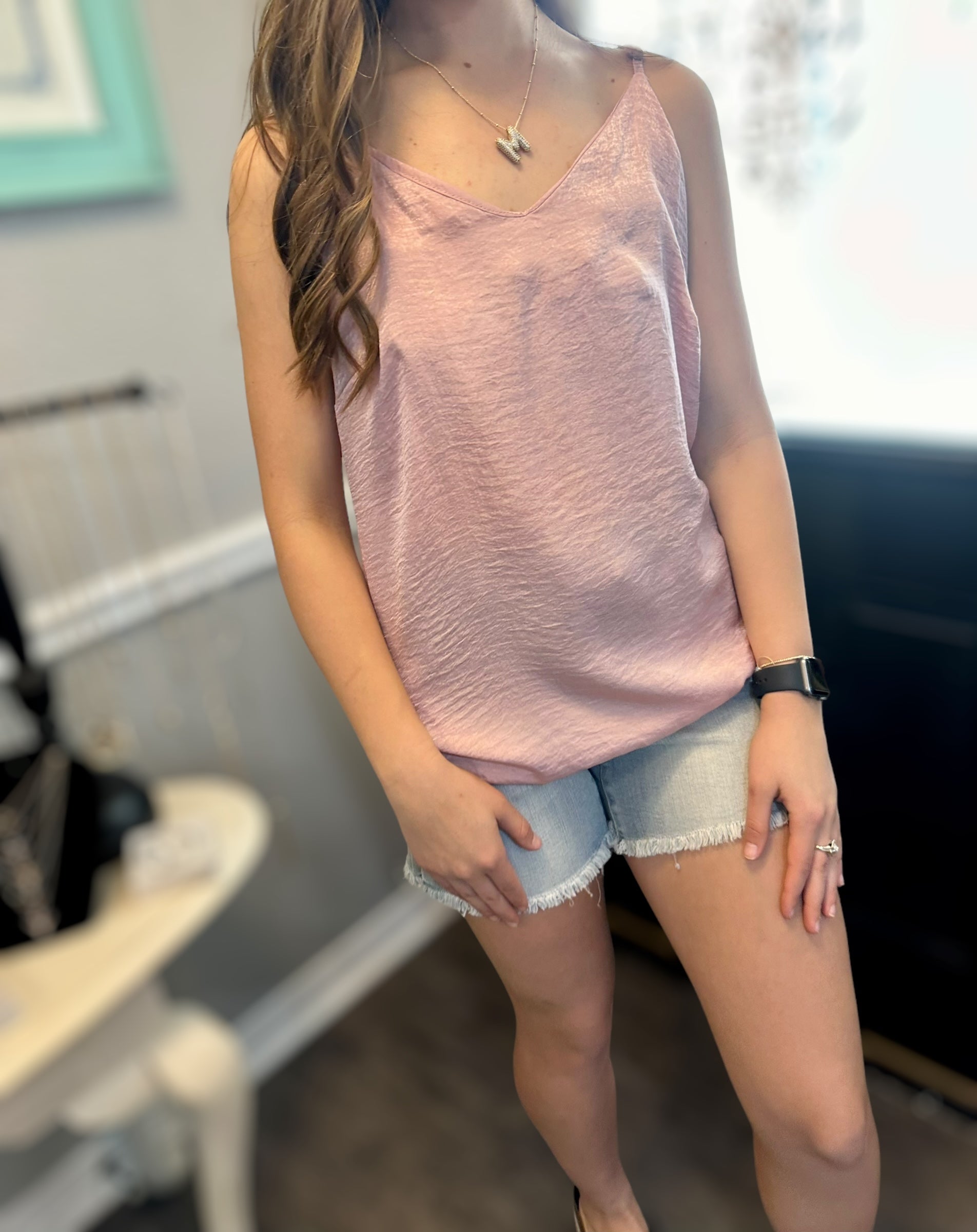 MAGIC FIT Cami in pink, featuring a reversible design, styled with denim shorts for a versatile summer look.