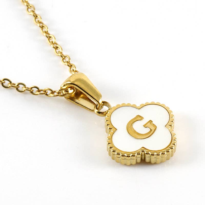 MONOGRAM MOMENTS NECKLACE featuring a gold pendant with a white inlaid initial 'G' on a delicate gold chain.