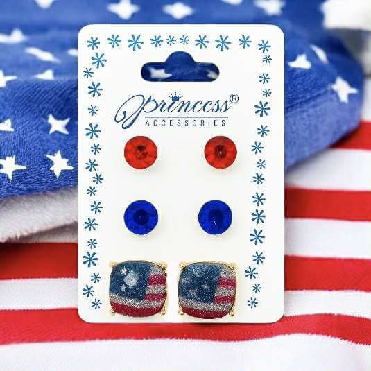 Freedom Trio Earring Set featuring patriotic red, white, and blue studs on a star-patterned background.
