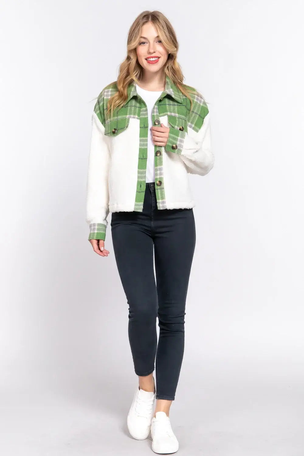 Model showcasing the ALPINE CHARM JACKET in pine green plaid flannel and sherpa, styled for winter fashion.