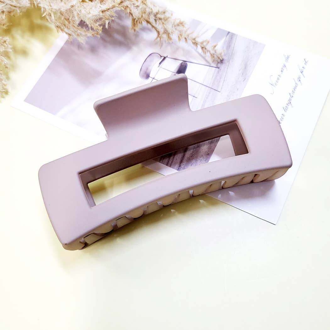 Chic Simplicity large claw clip in matte finish, perfect for effortless hair styling, placed on a stylish background.