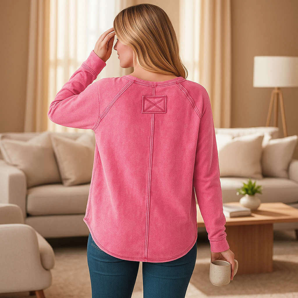 Coastline Calm - Zenana (fuchsia) back view of soft mineral wash top with thumbhole cuffs in cozy living room setting.