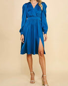 Elegant blue Indigo Hour Midi Dress by Pinch with surplice bodice and skirt slit, perfect for versatile styling.