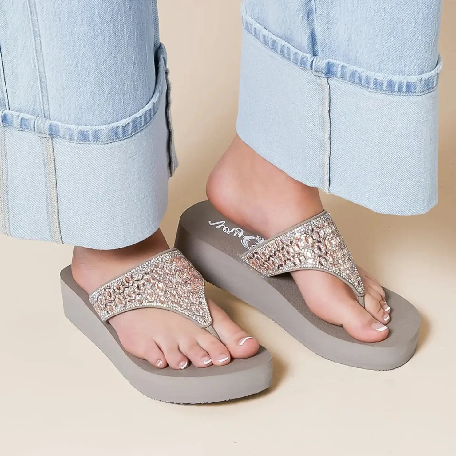 Sparkling Napoli Glitz Sandals by Very G with rhinestone straps on a light gray flatform sole.
