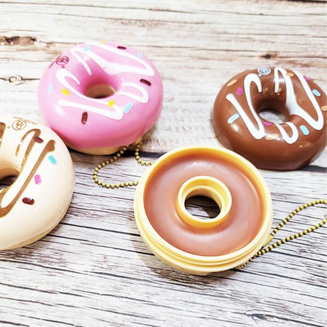 Colorful Donut Worry Lip Balms on keychains - travel-friendly lip care in pink, chocolate, and cream flavors.