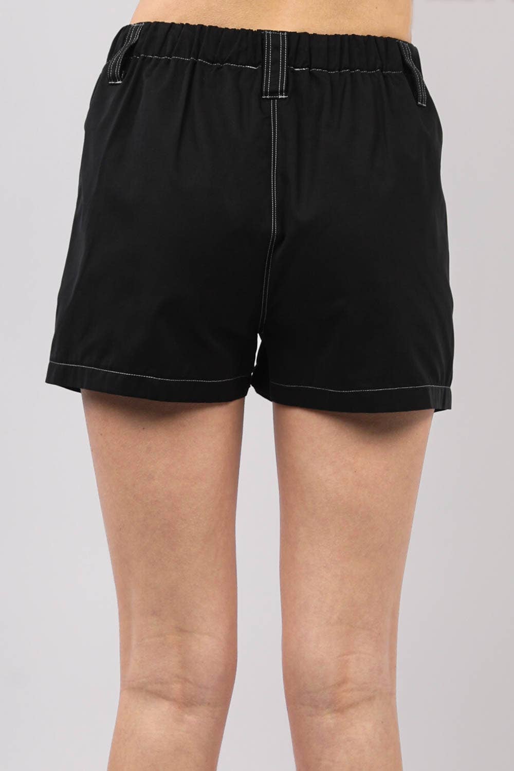 Back view of Play It Cool Shorts in black, featuring an elastic waistband and relaxed fit for comfort.
