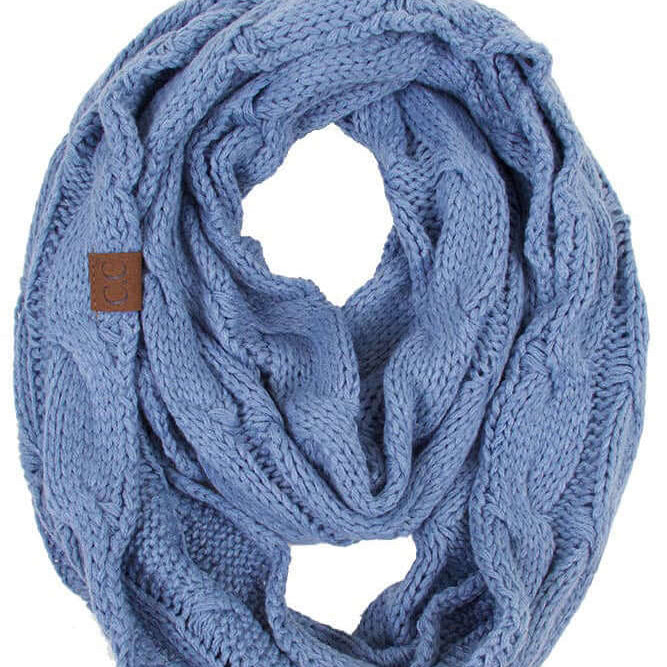 C.C Story Book knitted infinity scarf in Denim Blue color, featuring cozy cable knit design.