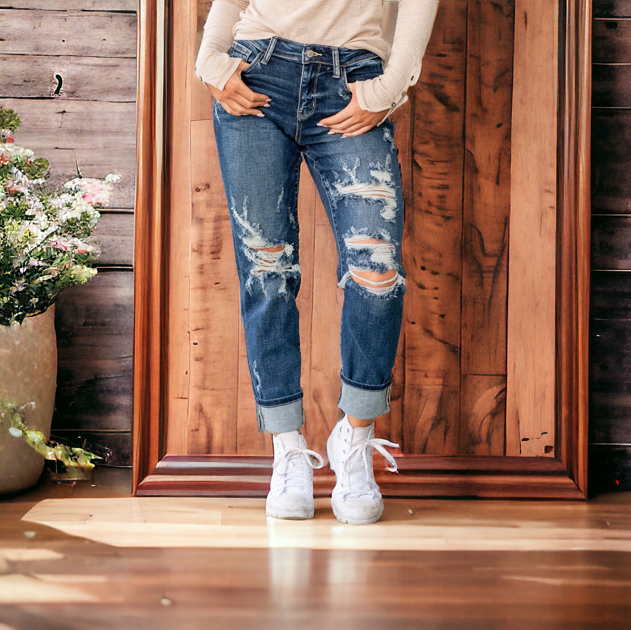 Judy Blue Zoe Boyfriend Jeans in dark wash, mid-rise, cuffed with distressed details, styled with white sneakers.