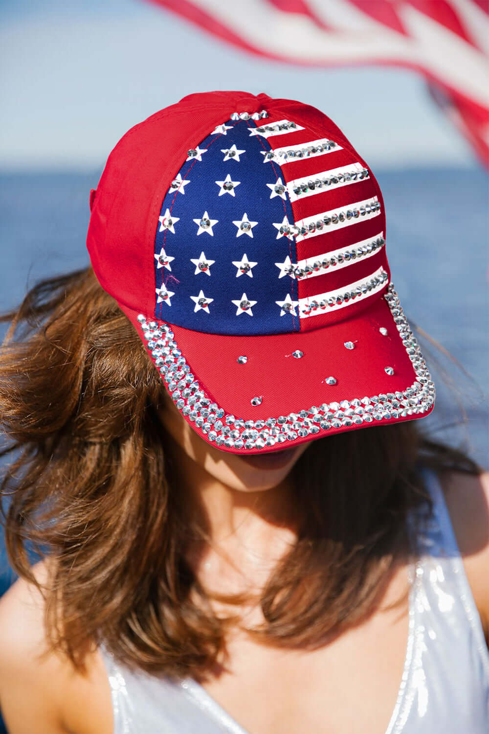 Let Freedom Bling hat with American flag design and rhinestones, showcasing patriotic style and comfort.