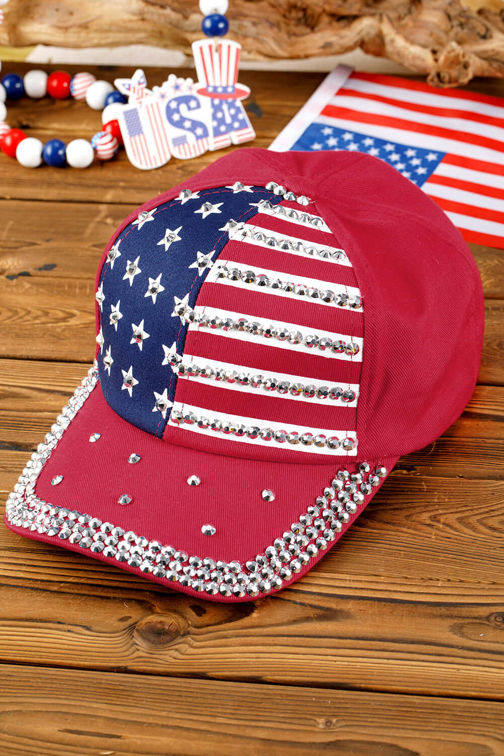 Let Freedom Bling hat with rhinestones and American flag print, perfect for showcasing patriotic style.