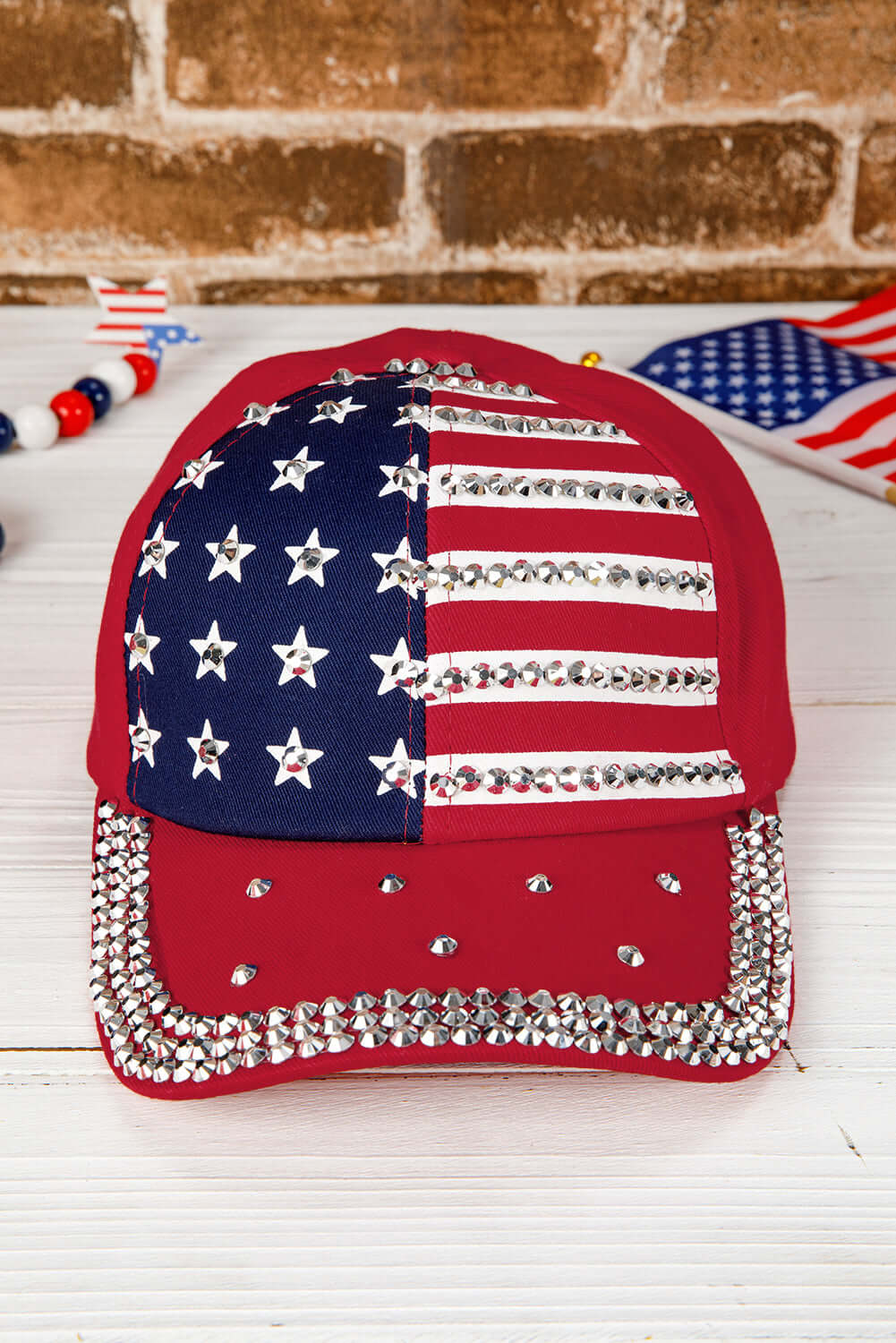 Let Freedom Bling Hat with American flag print and rhinestone details on a fiery red cap.