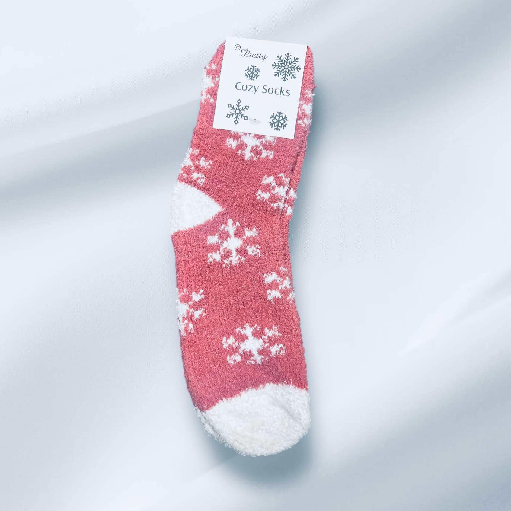 Cozy WINTER SNOWFLAKE Sherpa Socks in pink with white snowflakes, perfect for winter warmth and style.