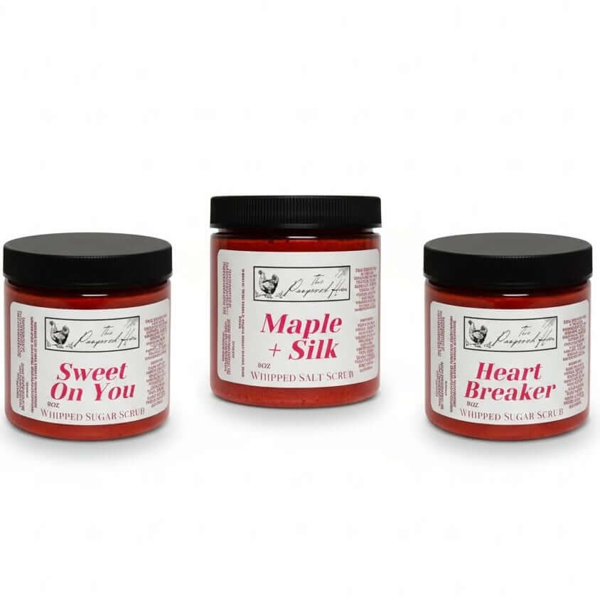 PAMPERED HEN- Body Scrub 3 Scent Choices: Sweet On You, Maple + Silk, and Heart Breaker jars displayed.