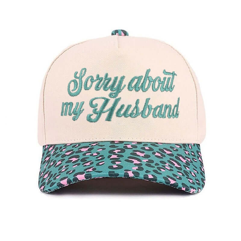 SORRY ABOUT MY HUSBAND HAT (6 colors) in cream and leopard print, featuring embroidered text for a fun statement.