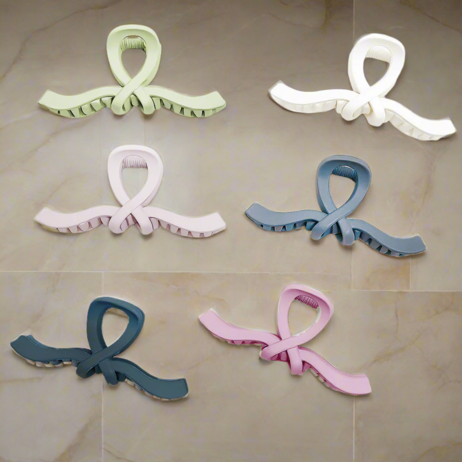 Ribbon Revival Hair Clips in six colors, featuring matte bow designs for stylish and secure hair hold.