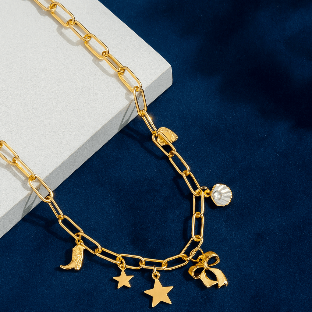 Coastal Darling Charm Necklace with gold-tone chain and seaside-inspired charms including a star, heart, seashell, and boot.
