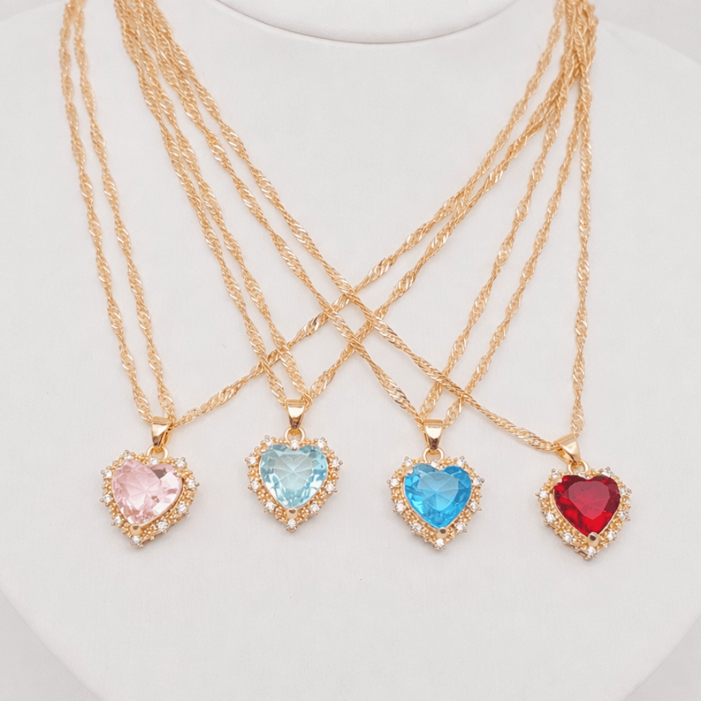 Heart-shaped Pendant Necklace Inlaid Cubic Zirconium with pink, blue, and red stones on gold chains.