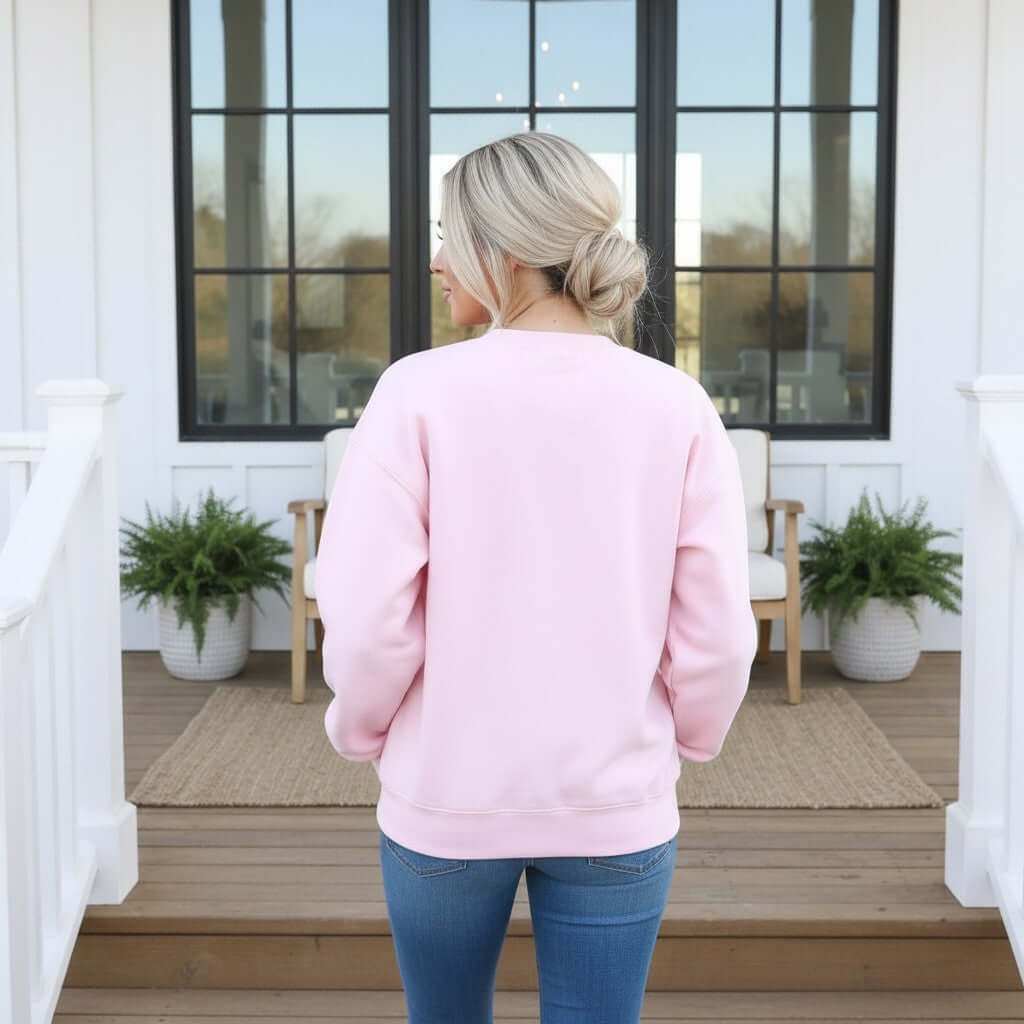 Model wearing LULU MAC PINK W/ RED GINGHAM CREWNECK from the back, showcasing the soft pink color and relaxed fit.