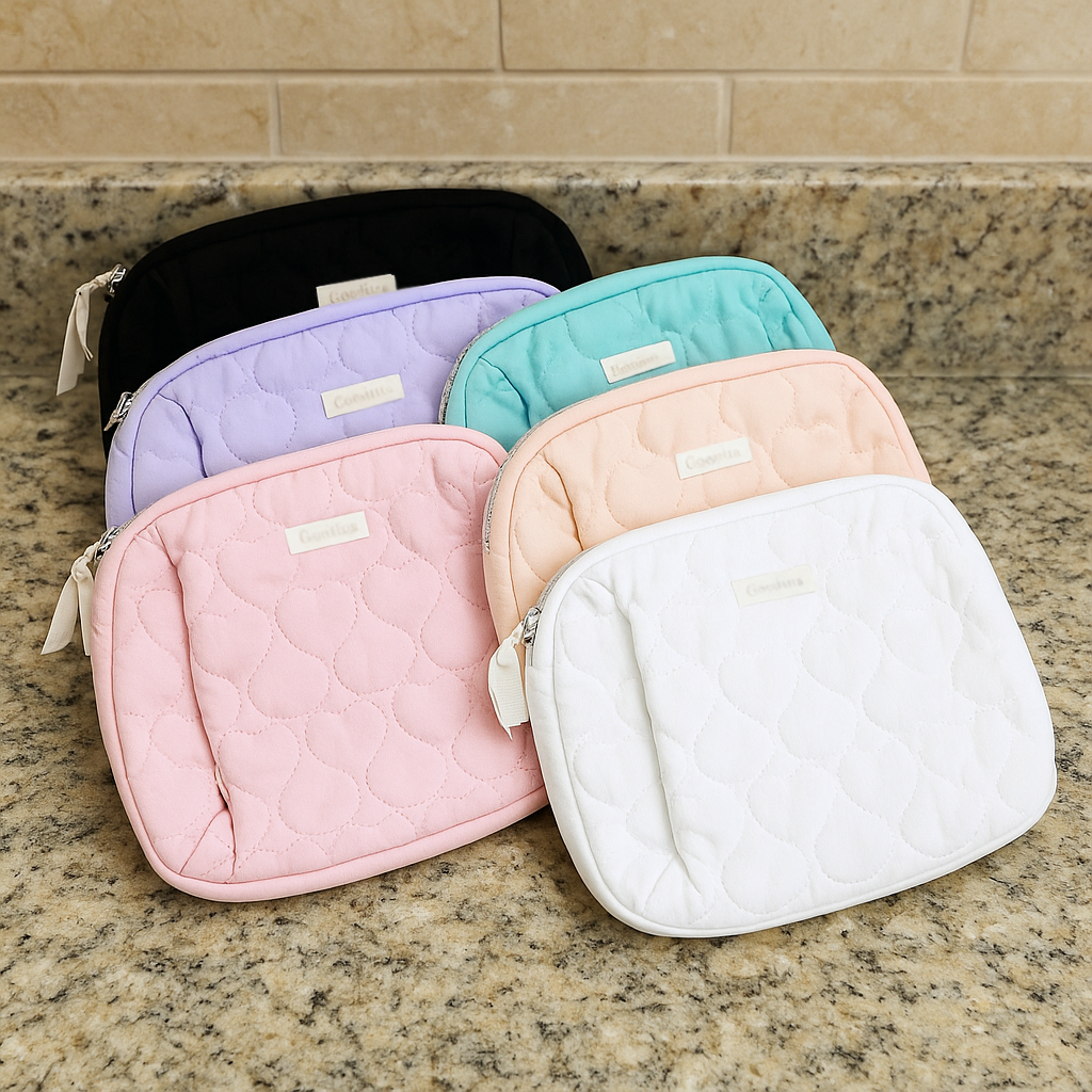 Colorful Love Language Makeup Bags in six pastel designs on a granite countertop.