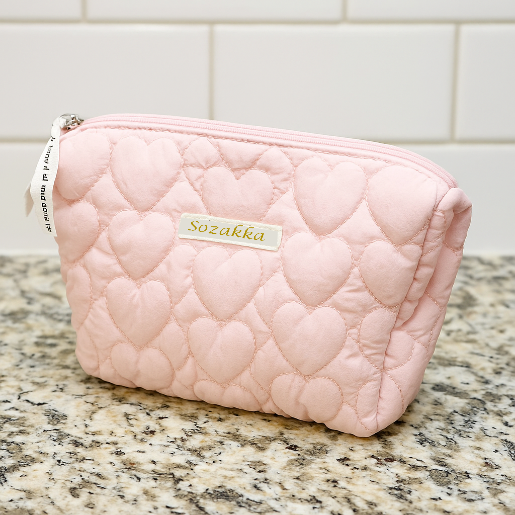 Sozakka Love Language quilted makeup bag in Candy Pink with stitched heart design, perfect for stylish organization.
