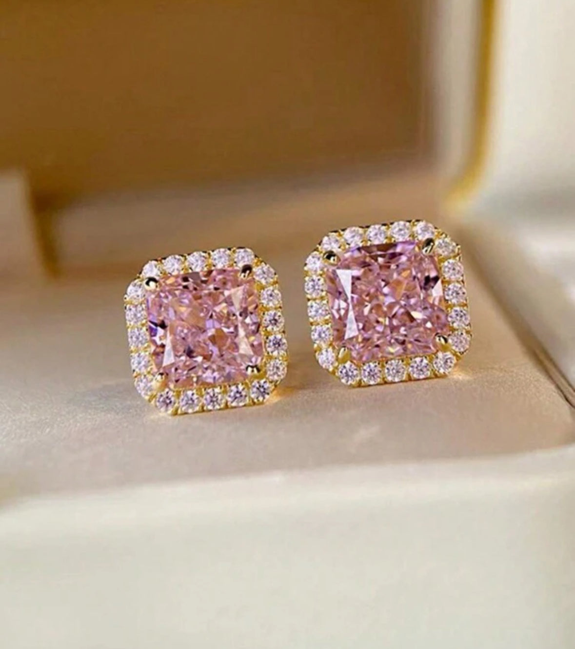 Dazzling pink ice sparkle earrings with rhinestones and cubic zirconia, perfect for adding glamour to any outfit.