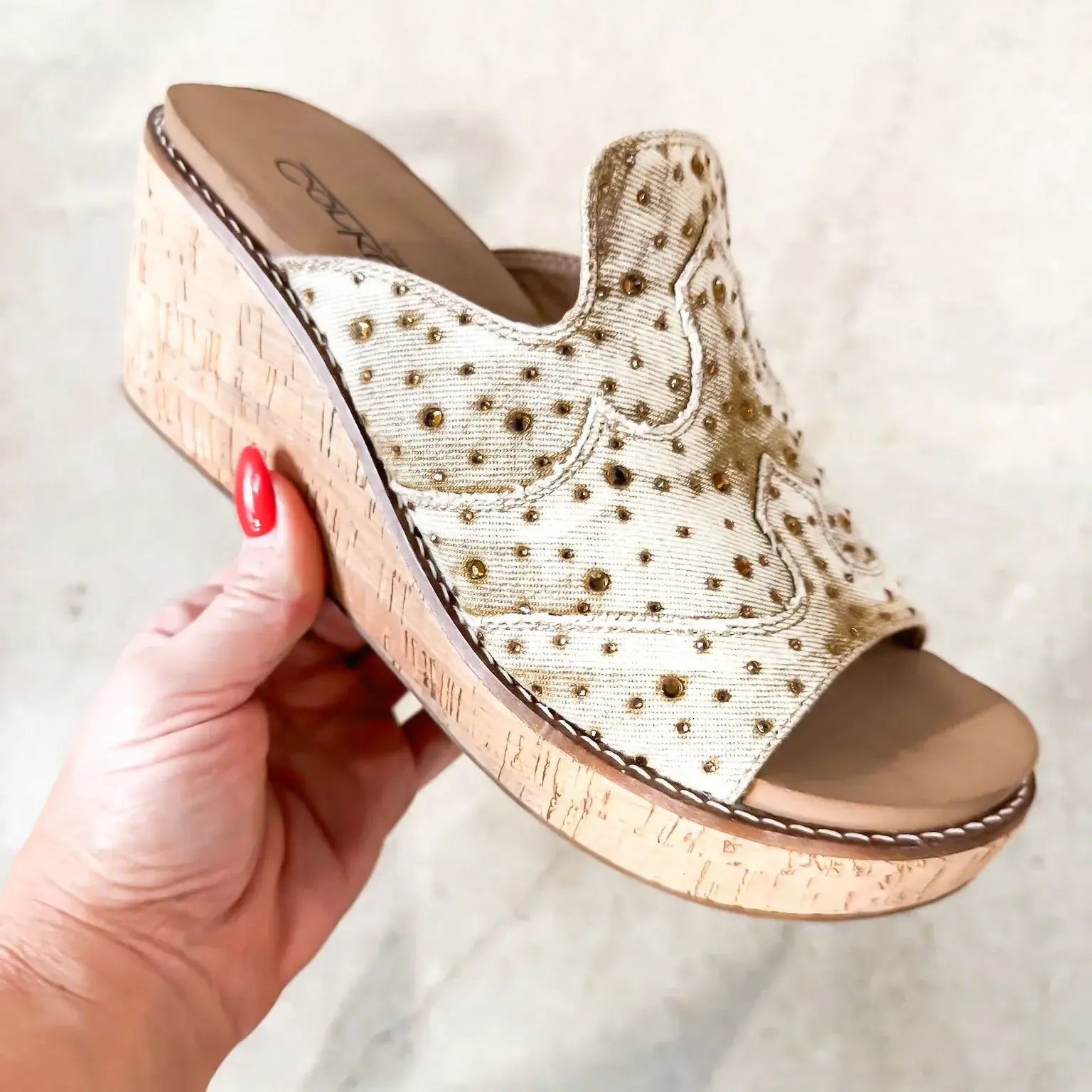CORKYS NEON MOON WEDGES showcasing a neutral faux suede upper with metallic studs and a cork wedge for stylish comfort.