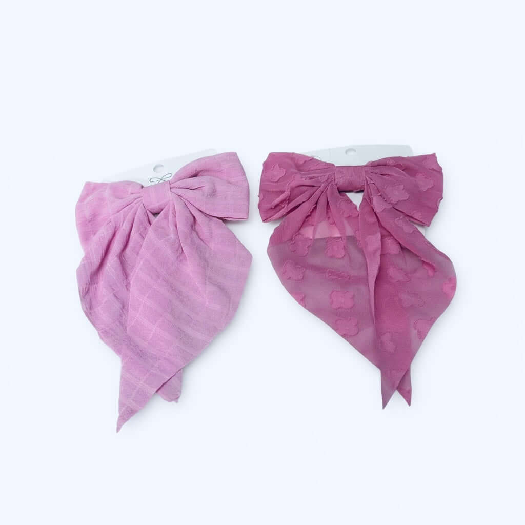 DAYDREAM HAIR BOW 2 pk featuring two feminine pink hair bows, one taffy pink and one baby pink, perfect for styling.